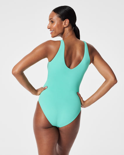 One editor's review on the Spanx Pique Shaping Plunge One-Piece Swimsuit.