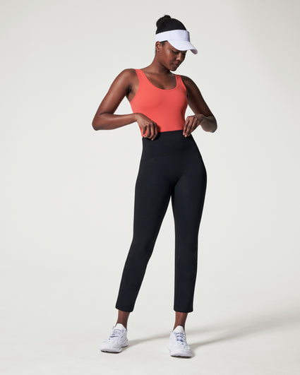 Black sports flare pants with slit for women, ankle length gym pants.